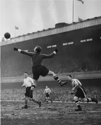 Bernard Streten punches the ball clear