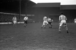 Gordon Turner tussles with a Coventry defender watched by Bob Morton