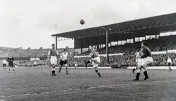 Gordon Turner watches as Billy Lucas slices his clearance