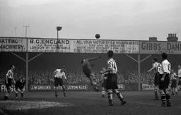 Roy Davies is ready to pounce as the Lincoln keeper attempts to punch the ball clear