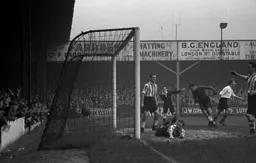 Roy Davies turns away after Bert Mitchell (out of picture) scores the opening goal
