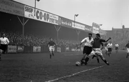 Jesse Pye holds off Rovers centre half Bill Paterson