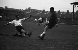 Argyle keeper Bill Shortt saves with his feet as Bernard Moore slides in