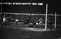 The Argyle keeper gathers the ball as Bernard Moore dives over him