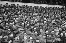 A section of the 21,034 crowd in what looks like a packed enclosure.