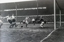 Bernard Moore shoots from close range but Bert Trautmann makes the save