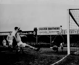 Ron Baynham watches as the ball goes wide