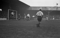 Leicester right back Stan Milburn punches the ball over the bar. It is a penalty.