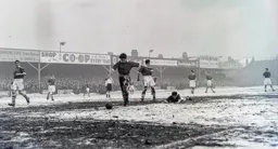 Anxious looks on the Bolton defence as Gordon Turner is sent sprawling in the snow