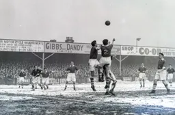 Two Bolton defenders combine to clear the ball