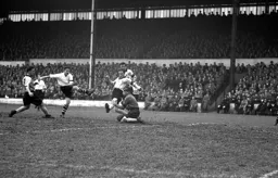 City keeper Billy Bly saves at point blank range from Hugh McJarrow