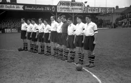 Observing a minutes silence before the game following the death of Queen Mary