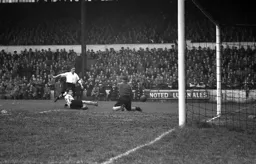 Bert Mitchell sees his shot blocked by City keeper Billy Bly