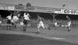 Forest keeper Harry Walker and Jack Birkett number 6 collide trying to clear the ball. Roy Davies on the left and Gordon Turner look on