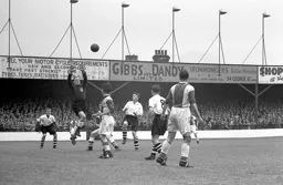 The Olham keeper rises to catch the ball