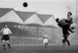 Len Stephenson lifts the ball over Bernard Streten for Blackpool`s second goal