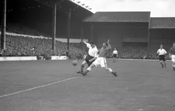 George Cummins forces his way into the penalty area