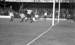 Bernard Moore cannot quite connect to a cross by Arthur Taylor