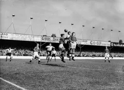 Jesse Pye gets between defenders