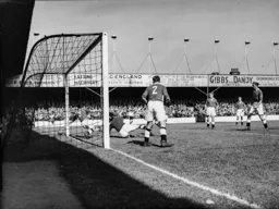 The Swansea defence cannot prevent Bert Mitchell`s shot for Town`s first goal