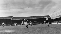 Bernard Moore sends the ball into the penalty area