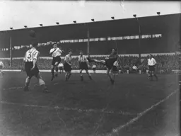 City keeper Jerry Lowery hacks the ball clear away from Johnny Downie