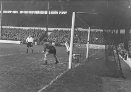 Bert Mitchell watches Roy Davies shot enter the net for the only goal of the game