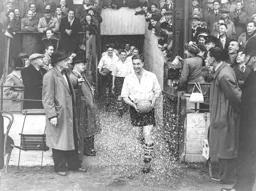 Bob Morton who was married that morning is greeted with a shower of confetti