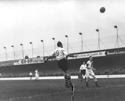 Jesse Pye heads the ball across the penalty area