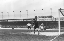 Gordon Turner can only watch as Ernie Gregory spills the ball