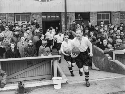 Syd Owen leads the team out