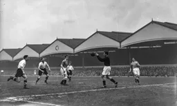Gordon Turner and Syd Owen can only look on as George Farm grabs hold of the ball
