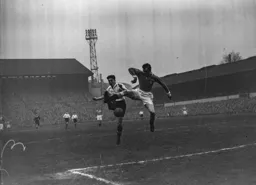 Gordon Turner gets into a tangle with a defender