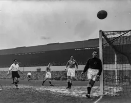 Gordon Turner watches as the ball drifts wide of the goal