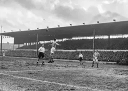 Roy Davies watches as the ball is headed clear