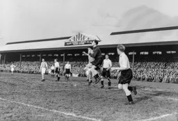 Ian Black gathers the ball under pressure from Bob Morton