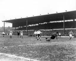 Gordon Turner sees his shot blocked by Notts County keeper Gordon Bradley