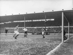 On its way. Gordon Turner watches Roy Davies header head towards the net for Town`s first goal