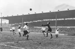 Howard Radford punches the ball clear from Jim Pemberton