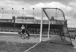 Bert Mitchell (out of shot) nets