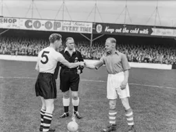 Syd Owen and former Hatter Horace Gager shake hands prior to the kick off. The referee is Mr Luty from Leeds