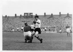The ball pops out as Jimmy Adam charges in on Forest keeper Harry Walker