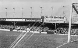 Gordon Turner wheels away after sending the ball on its way for Town`s first goal