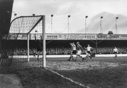 Bob Morton and Jimmy Adam watch as the ball drifts off target