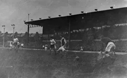 An easier moment for Reg Elvy as he scoops up this effort from Bob Morton