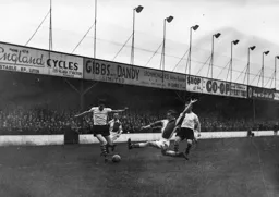 Gordon Turner has to avoid this lunging tackle