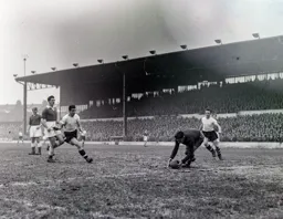 Jim Pemberton makes a forward run but is beaten to the ball