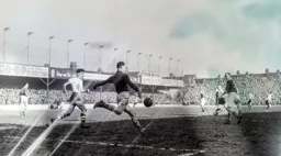 Ian Black clears the ball downfield with Gordon Turner in close attendance