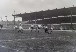 Bob Morton attempts to lob the ball over Gordon Bradley