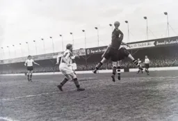Gordon Turner looks on as Ray Chandler has to deal with a high ball